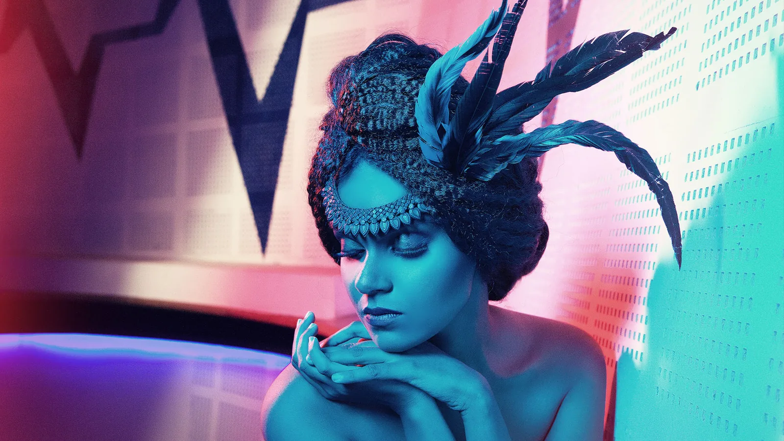 Bridal hairstyling with a feather headpiece, close-up beauty look